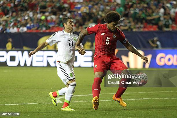 July 22: Roman Torres of Panama fights for the ball with Carlos Esquivel during a semi final match between Mexico and Panama as part of Gold Cup 2015...