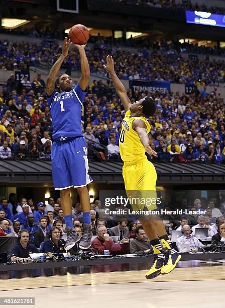 Kentucky Wildcats guard/forward James Young hit a 3-pointer against Michigan Wolverines guard Derrick Walton Jr. During the NCAA Tournament's Midwest...