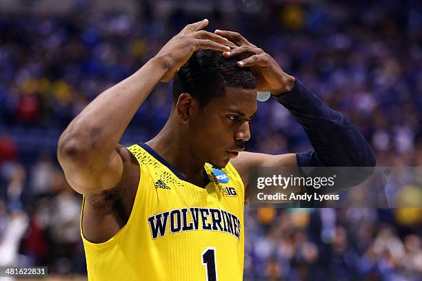 Glenn Robinson III of the Michigan Wolverines reacts after being defeated by the Kentucky Wildcats 75 to 72 in the midwest regional final of the 2014...