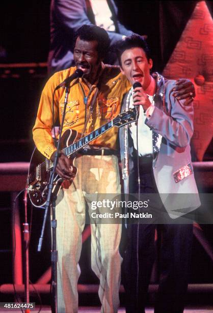 Musicians Chuck Berry and Julian Lennon perform onstage at the Fox Theater during the filming of the movie 'Hail! Hail! Rock 'n' Roll' , St Louis,...