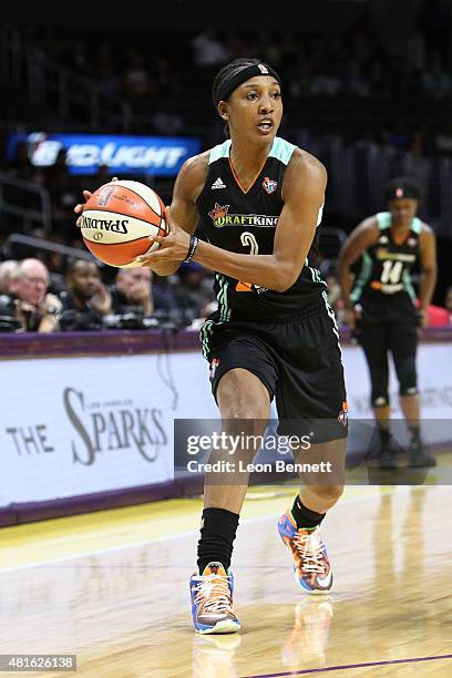 Candice Wiggins of the New York Liberty handles the ball against the Los Angeles Sparks in a WNBA game at Staples Center on July 22, 2015 in Los...