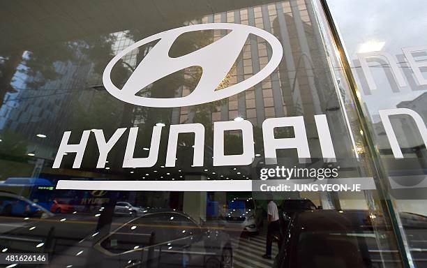 Logo of Hyundai Motor is seen on a glass door at a company branch in Seoul on July 23, 2015. Hyundai Motor Co. Said on July 23 its second-quarter net...