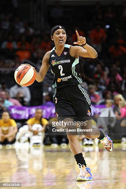 Candice Wiggins of the New York Liberty handles the ball against the Los Angeles Sparks in a WNBA game at Staples Center on July 22, 2015 in Los...