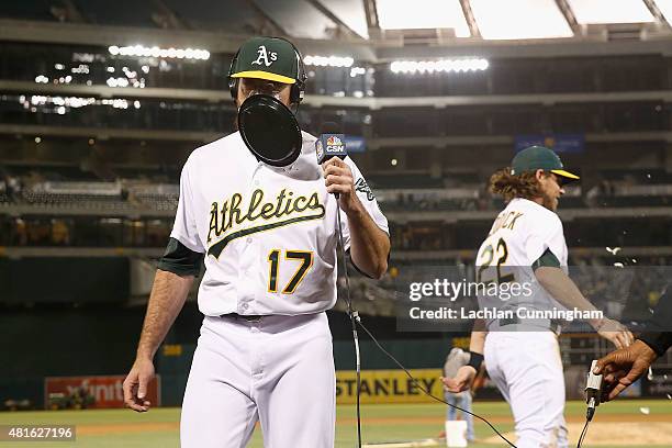 Ike Davis of the Oakland Athletics is hit in the face with whipped cream by Josh Reddick of the Oakland Athletics after Davis hit a walk-off RBI...