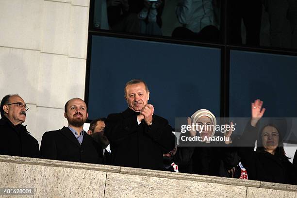 Turkish Prime Minister Recep Tayyip Erdogan greets the crowd from the balcony of the Justice and Development Party headquarters in Ankara, Turkey on...