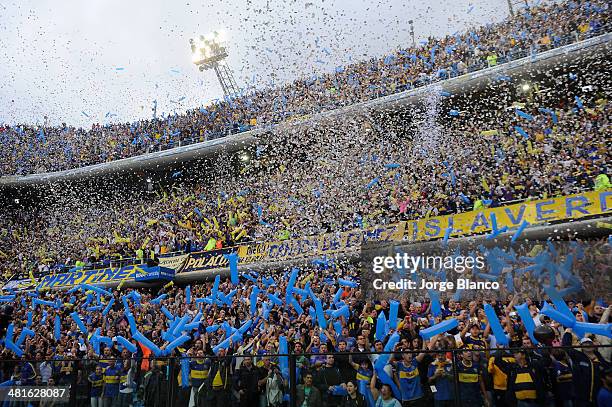 Supporters of Boca Juniors cheer for their team during a match between Boca Juniors and River Plate as part of 10th round of Torneo Final 2014 at...