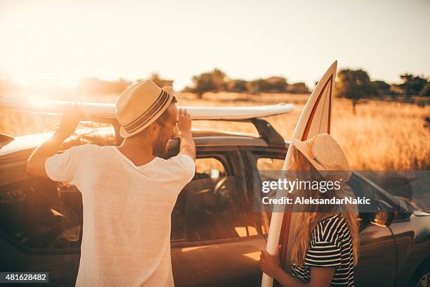 packing the surfboards - straw hat stock pictures, royalty-free photos & images