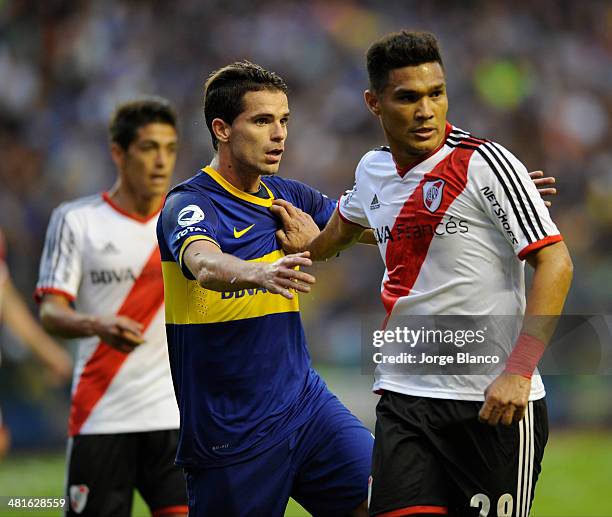Teofilo Gutierrez of River Plate and Fernando Gago of Boca Juniors during a match between Boca Juniors and River Plate as part of 10th round of...