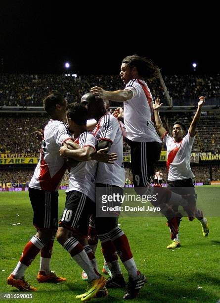 Manuel Lanzini , of River Plate, celebrates with teammates after scoring the first goal during a match between Boca Juniors and River Plate as part...