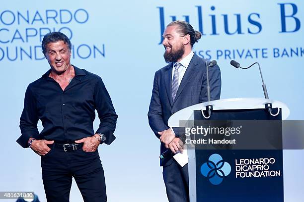 Sylvester Stallone and Leonardo DiCaprio speak onstage at a Dinner and Auction during The Leonardo DiCaprio Foundation 2nd Annual Saint-Tropez Gala...