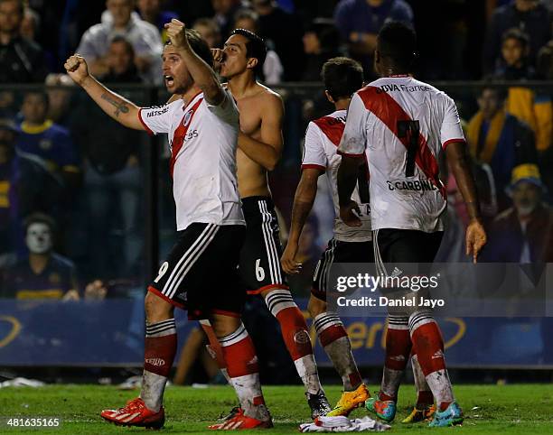 Ramiro Funes Mori, of River Plate, celebrates with teammates after scoring during a match between Boca Juniors and River Plate as part of 10th round...