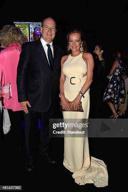 Prince Albert II of Monaco and Caroline Scheufele pose as they attend a cocktail reception during The Leonardo DiCaprio Foundation 2nd Annual...