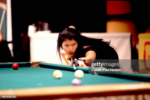 Billiard player Jeannette Lee lines up a shot, Chicago, Illinois, 1985.