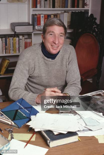 Pulitzer Prize-winning novelist John Updike photographed working at his home in Beverly Farms, Massachusetts in 1978.