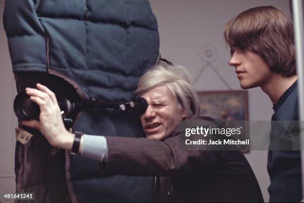 Andy Warhol filming an early scene of director Paul Morriseys Women in Revolt, 1970.