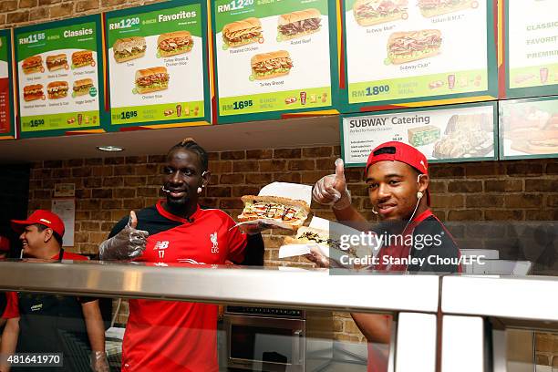 Mamadou Sakho and Jordan Ibe of Liverpool FC gives a thumbs up during meet and greet the fans at the Subway Cafe in Paradigm Mall on July 23, 2015 in...