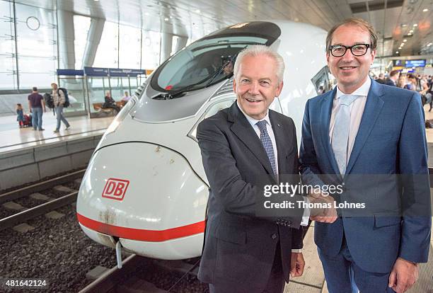 Deutsche Bahn CEO Ruediger Grube and Transport and Digital Technologie Mininister Alexaner Dobrindt shake hands in front of the new ICE on July 23,...