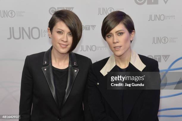Tegan Quin and Sara Quin arrive at the 2014 Juno Awards on March 30, 2014 in Winnipeg, Canada.