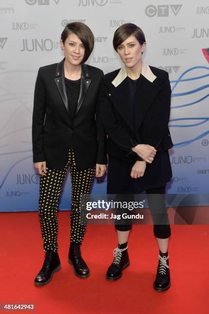 Tegan Quin and Sara Quin arrive at the 2014 Juno Awards on March 30, 2014 in Winnipeg, Canada.