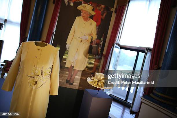 Dress and coat designed by Angela Kelly Couture and a hat by Rachel Trevor-Morgan all worn by Queen Elizabeth II for a garden party are shown at The...