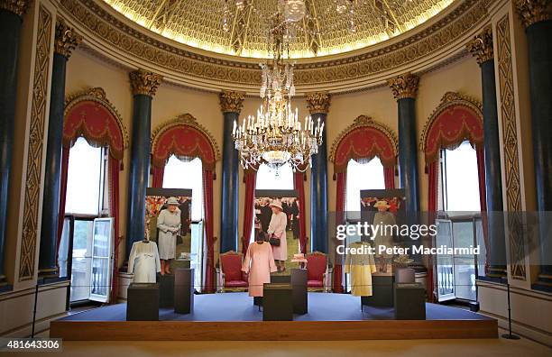 Outfits worn by Queen Elizabeth II for garden parties are shown at The Royal Welcome exhibition Summer opening at Buckingham Palace on July 23, 2015...