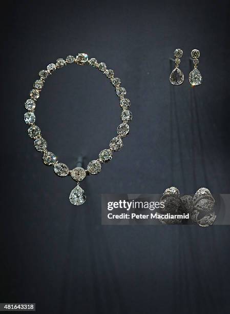 Queen Elizabeth II's Coronation Necklace and Earings are displayed with Queen Mary's Dorset Bow Broach at The Royal Welcome Summer opening at...