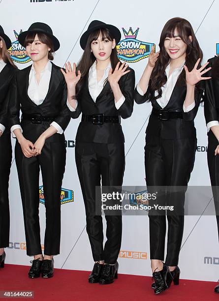 Girls' Generation pose for photographs during the MBC Music 'Show Champion' 100th anniversary event at Bitmaru on March 19, 2014 in Goyang, South...