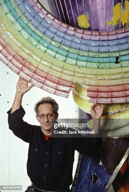 Painter and printmaker Frank Stella with his work in his New York studio in 1987.