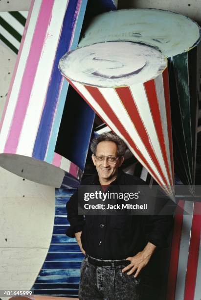 Painter and printmaker Frank Stella with his work in his New York studio in 1987.