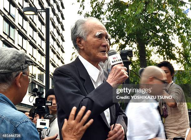 Former Japanese prime minister Tomiichi Murayama delivers a speech before civic group members during an anti-government rally outside the National...