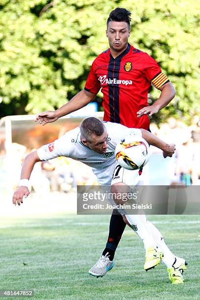 Uffe Bech of Hannover challenges Truyols of Mallorca during the preseason friendly match between Hannover 96 and RCD Mallorca at Wahren-Dorff stadium...