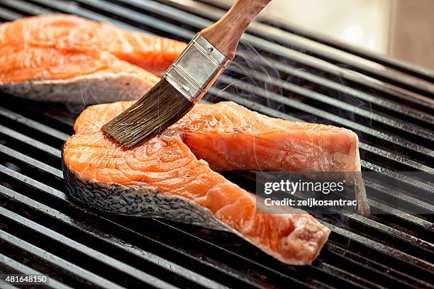 raw meat on the grill - basted stock pictures, royalty-free photos & images