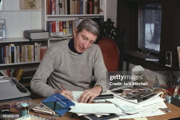 Pulitzer Prize-winning novelist John Updike photographed working at his home in Beverly Farms, Massachusetts in 1978.