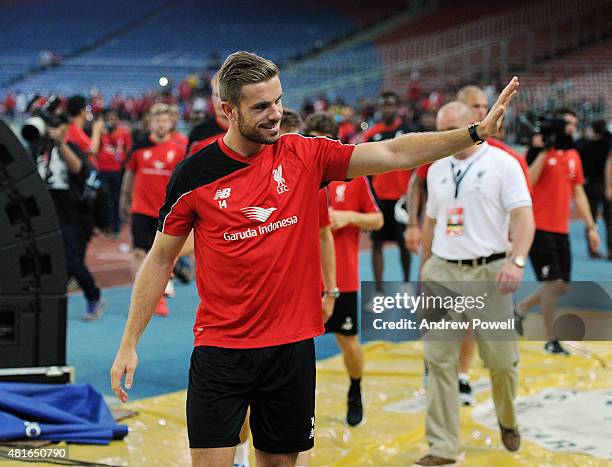 Jordan Henderson of Liverpool shows his appreciation to the fans at the end of a training session on July 23, 2015 in Kuala Lumpur, Malaysia.