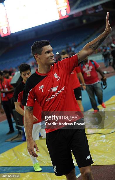 Dejan Lovren of Liverpool shows his appreciation to the fans at the end of a training session on July 23, 2015 in Kuala Lumpur, Malaysia.