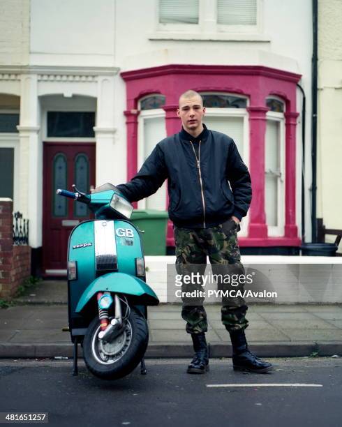 Young Skinhead, Kieron poses with his T5 Vespa outside his house in Portsmouth, UK..
