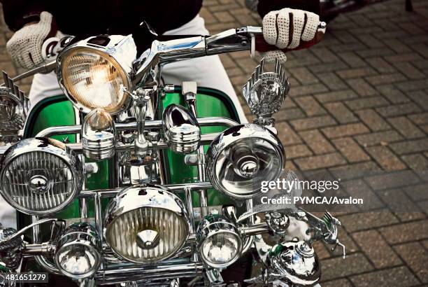 Mod Lambretta covered in Lights & Chrome pulls away on Ryde Seafront..