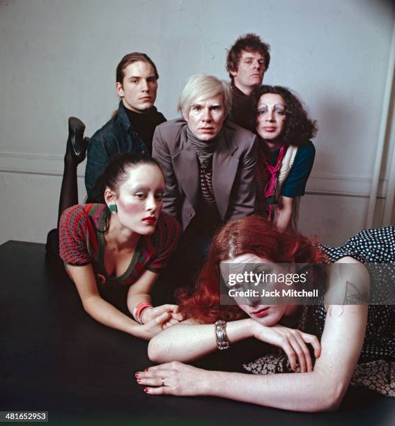 Andy Warhol photographed at the Factory with superstars Jane Forth, Jackie Curtis, Joe Dallesandro, Holly Woodlawn and film director Paul Morrissey.