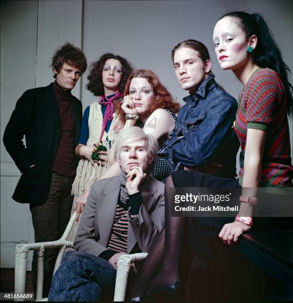 Andy Warhol photographed at the Factory with superstars Jane Forth, Jackie Curtis, Joe Dallesandro, Holly Woodlawn and film director Paul Morrissey.