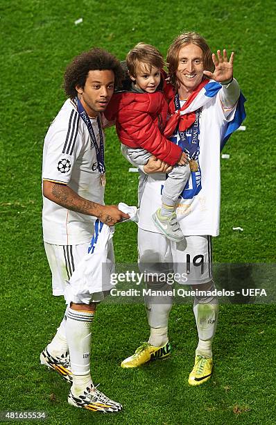 Marcelo of Real Madrid, Luka Modric of Real Madrid and his son Ivano celebrate following their team's 4-1 victory during the UEFA Champions League...