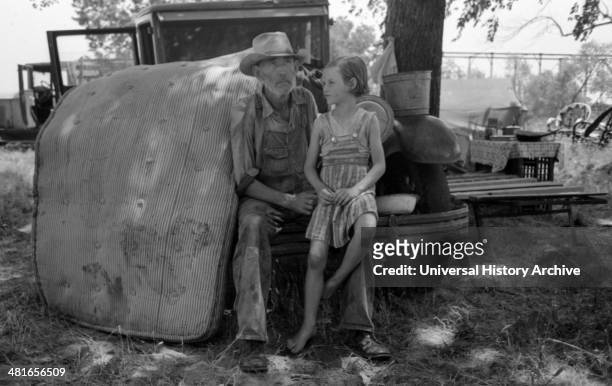 Veteran migrant agricultural worker with his daughter camped on Arkansas River, Wagon County, Oklahoma By Russell Lee, 1903-1986, photographer...