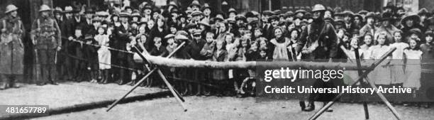 British soldiers guard a barricade, probably during The Irish War of Independence, circa 1920.