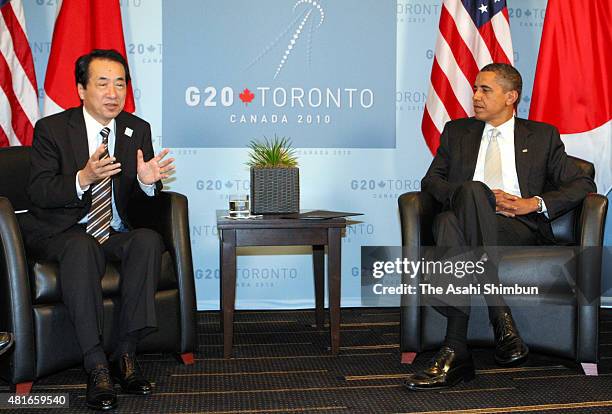 Japanese Prime Minister Naoto Kan and U.S. President Barack Obama talk during their bilateral meeting on the sidelines of the G20 Summit on June 27,...