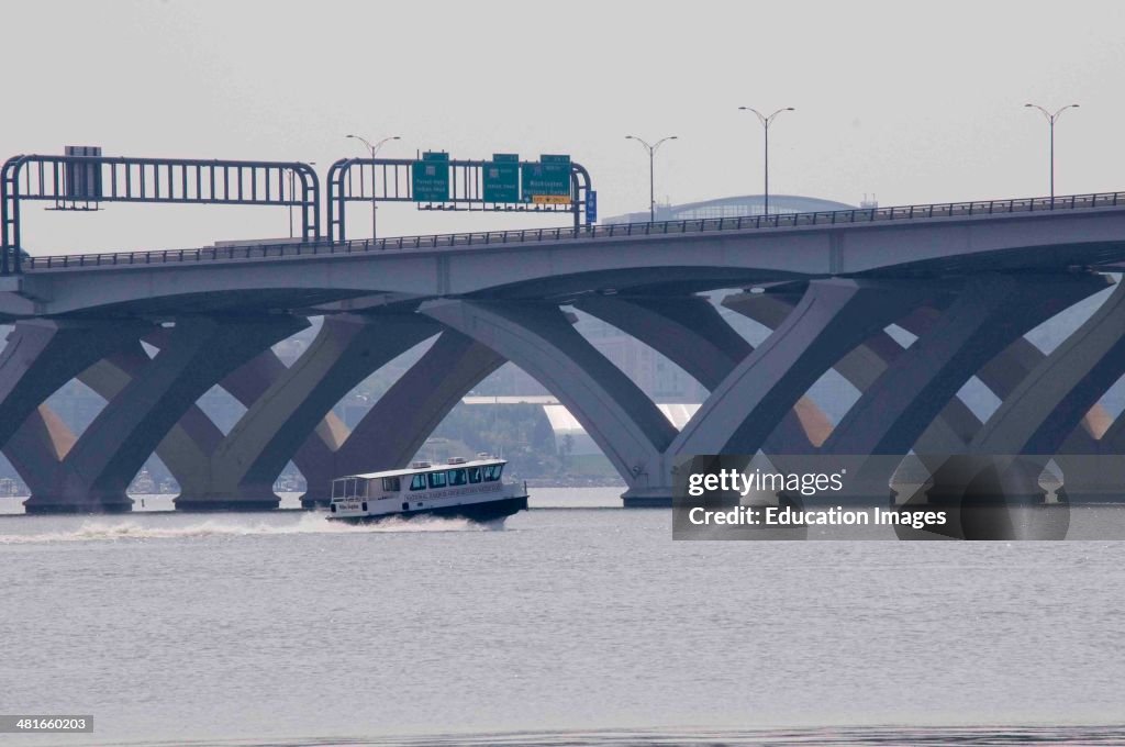 Water taxi navigates under Wilson Bridge on Potomac River