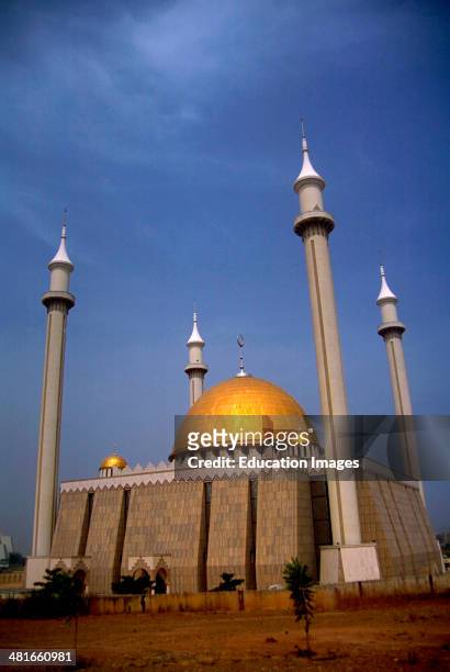 The new Grande Mosque in Abuja. Abuja is the capitol of Nigeria and was created by building an entirely new city on a barren plain in the center of...