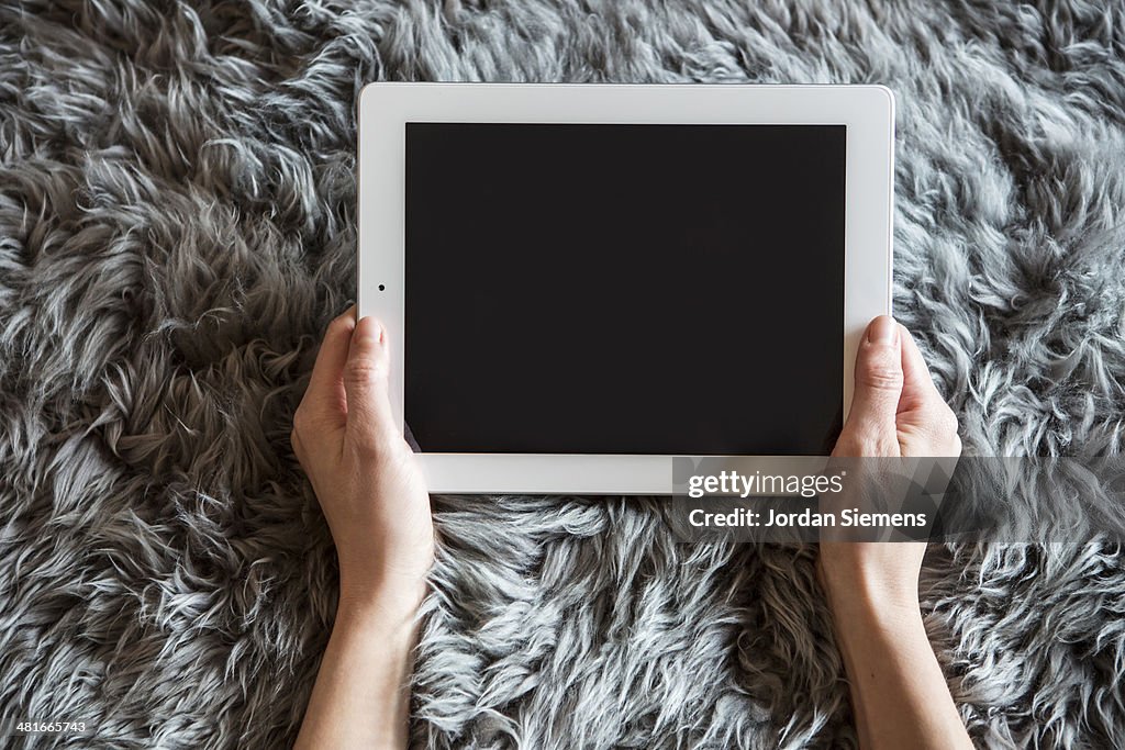 Female with tablet computer.