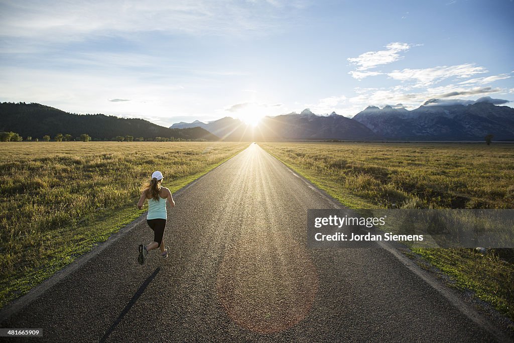 A Female Running At Sunset High-Res Stock Photo Getty Images