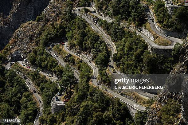 Cyclists climb the Lacets de Montvernier during the 186,5 km eighteenth stage of the 102nd edition of the Tour de France cycling race on July 23...