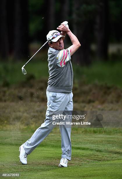 Mark McNulty of Ireland plays his second shot on the 12th hole during the first round of The Senior Open Championship at Sunningdale Golf Club on...