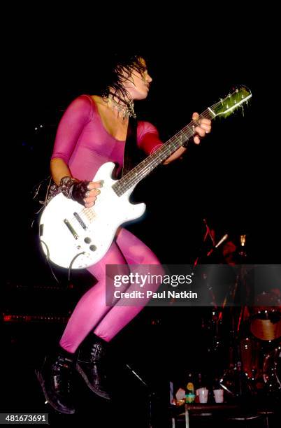 Musician Joan Jett performs onstage at the Poplar Creek Music Theater, Elgin, Illinois, June 15, 1987.